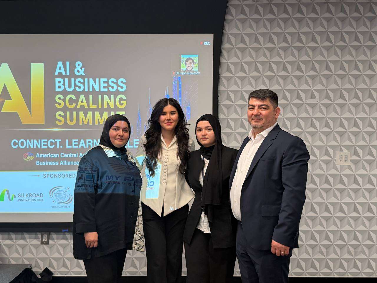 Speakers on stage at a business and technology summit