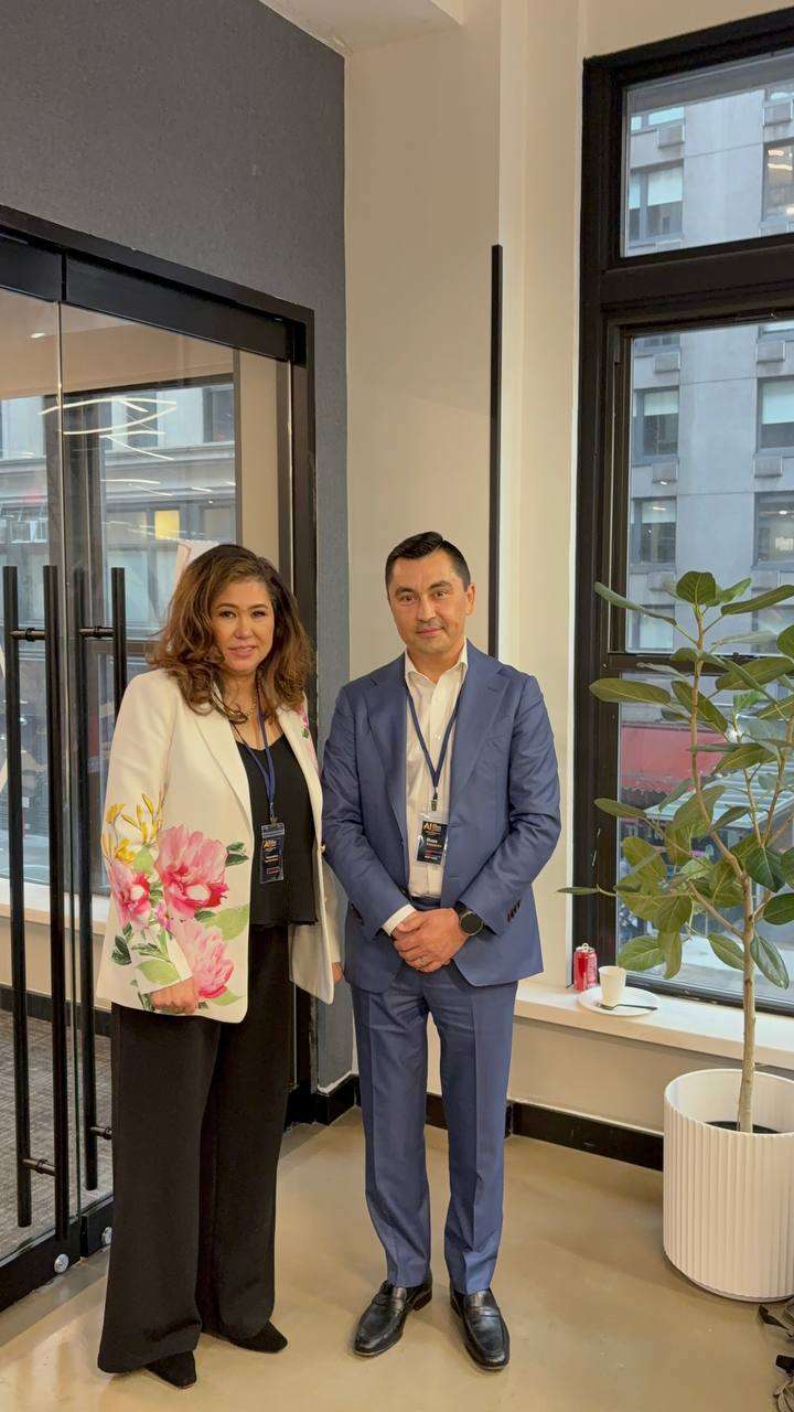 Two colleagues photographed during an office visit