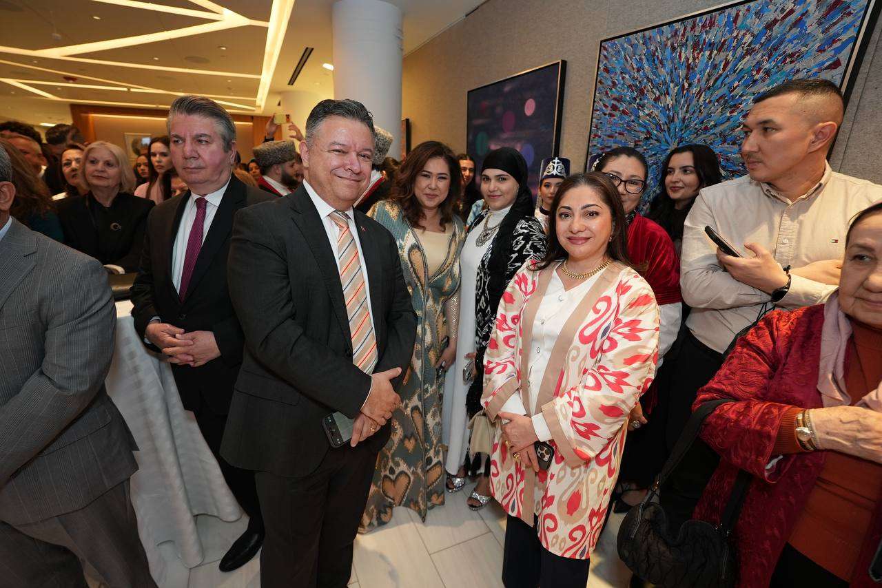 Guests mingling at a crowded community reception